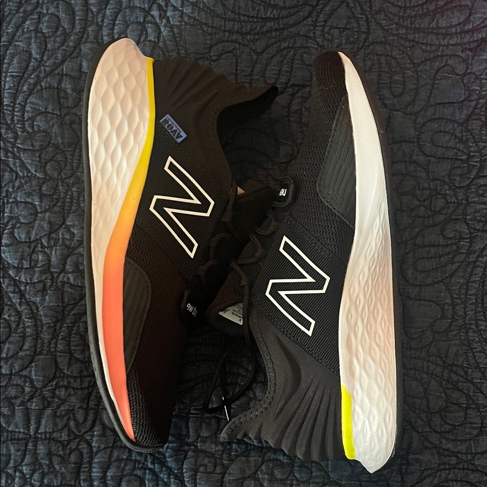 New Balance Women's Black Running Shoes with Orange-Yellow Gradient